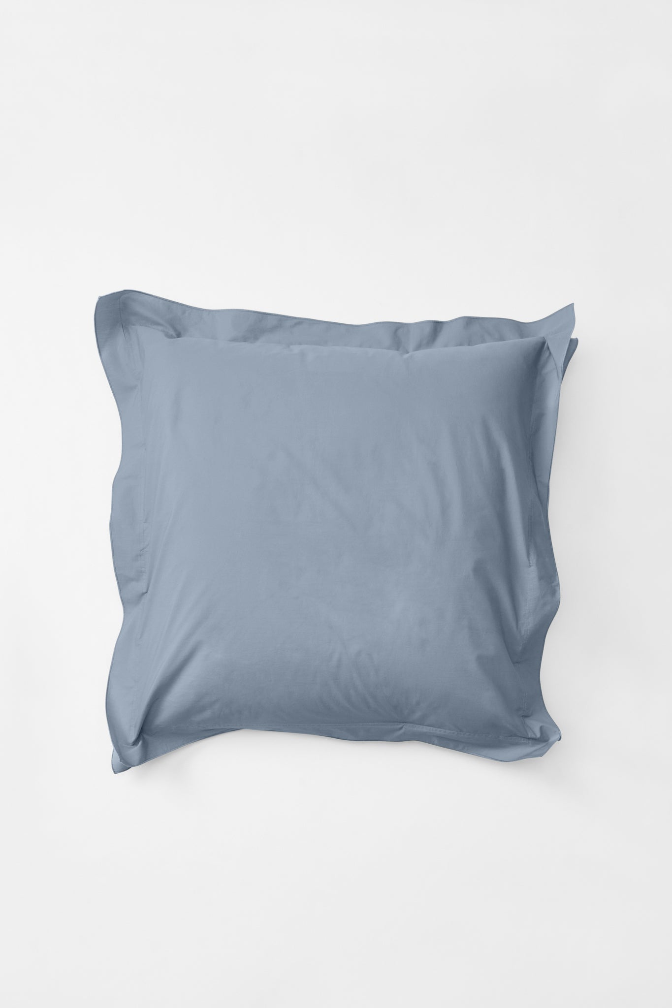 Aerial view of a 'Half Blue' euro pillow, gently ruffled at the edges.